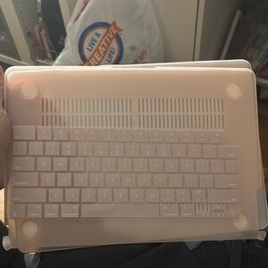 Apple Laptop with Pink Cover